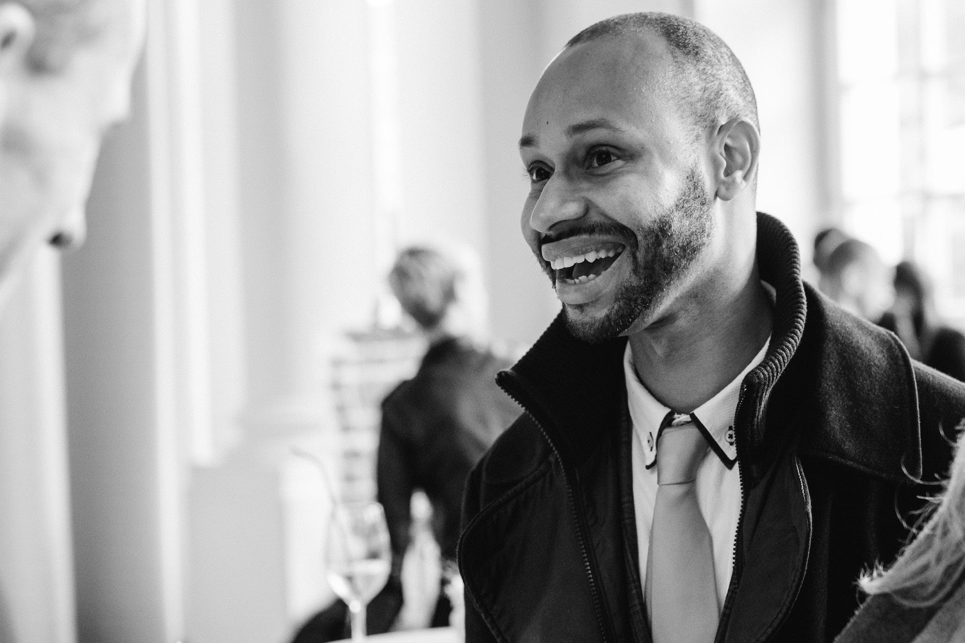 Andre Barrett speaking with founders at an event